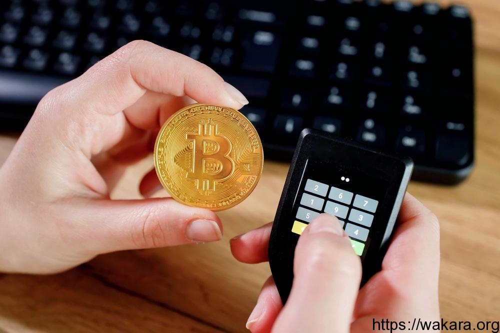 Close up womans hand holding bitcoin and cryptocurrencey hardware cold wallet on keybord background.